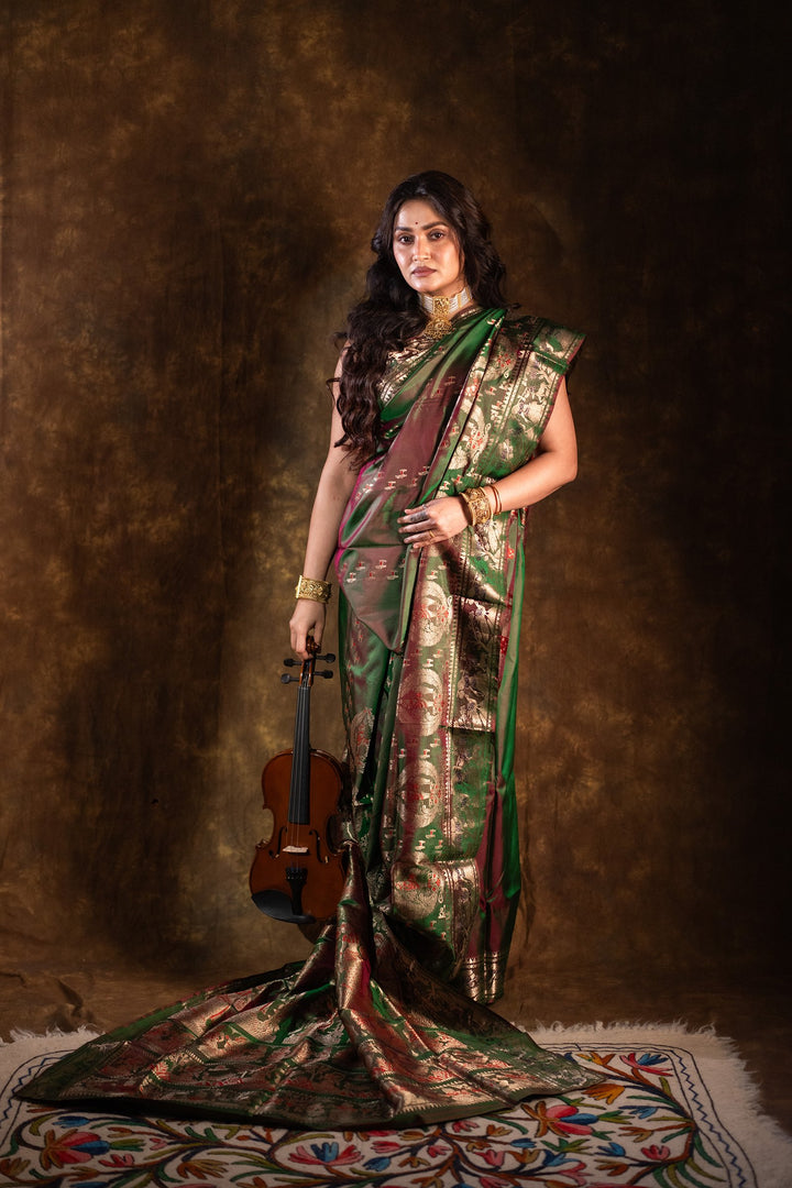 Mahakatha - Lush Green Baluchari Silk Saree with Grand Mythic Border Weaves